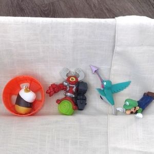 3 vintage McDonald's Happy Meal Toys and 1 vintage Burger King toy.